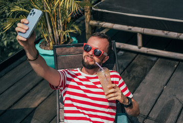 fashion beard man portrait, tattoo hand, Handsome man beard using smartphone in hand, happy face, street photo, hipster style portrait, isolated, make video, instagram. facebook, villa, subbed,juice