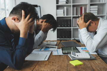 business people tired stressful headaches from problematic work unsuccessful and have office syndrome.