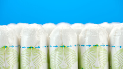 Hygienic Female tampons isolated on blue background