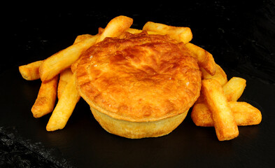 Steak and gravy puff pastry pie and chips meal
