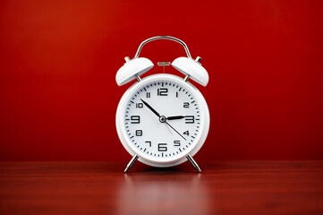 clock precious time alarm clock on red background concept of time working with time