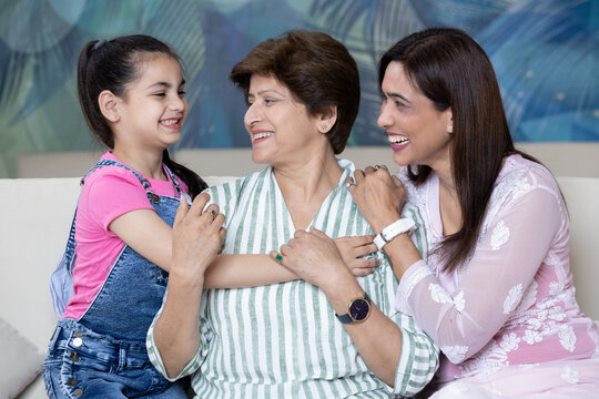  Indian multi generational family daughter and granddaughter  cheerfully enjoying together