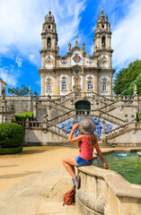Woman tourist in Portugal- Sanctuary Nossa Senhora dos Remedios in Lamego- Viseu distric, near Porto - obrazy, fototapety, plakaty