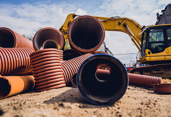 Big construction site with pipes and wires in the construction area. 