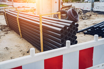 Big construction site with pipes and wires in the construction area. 