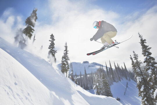  Skiing ecotourism. Skier in flight. Active rest in the mountains. Generative Al content