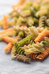 A variety of fusilli pasta made from different types of legumes, green and red lentils, mung beans...