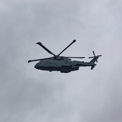 A Merlin Mk 4 Helicopter approaching HMS Condor flying low heading into the Naval Station of HMS Condor near to Arbroath.