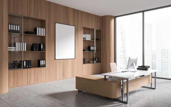 Light wooden CEO office with poster