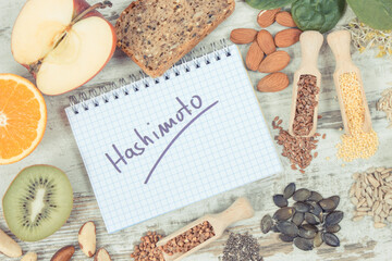 Fototapeta na wymiar Notepad with inscription hashimoto and best ingredients or products for healthy thyroid