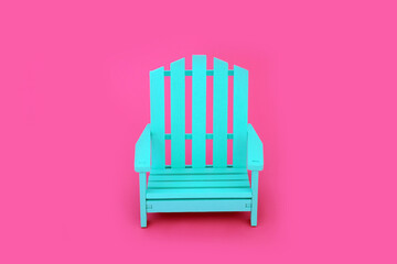 Trendy solitary slatted wooden blue chair on vivid pink background. Independent, modern contemporary stylish furniture, color, contrast, concept. Copy space. 