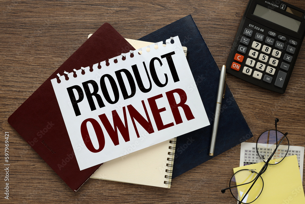 Poster product owner. text on the page of a notebook on three notebooks near the calculator