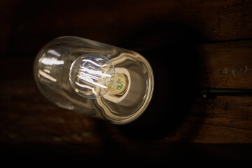 a light bulb in a dark hut