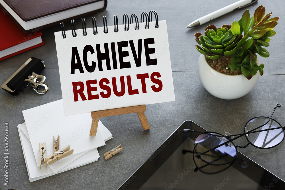 Poster achieve results. notebook with text on stand