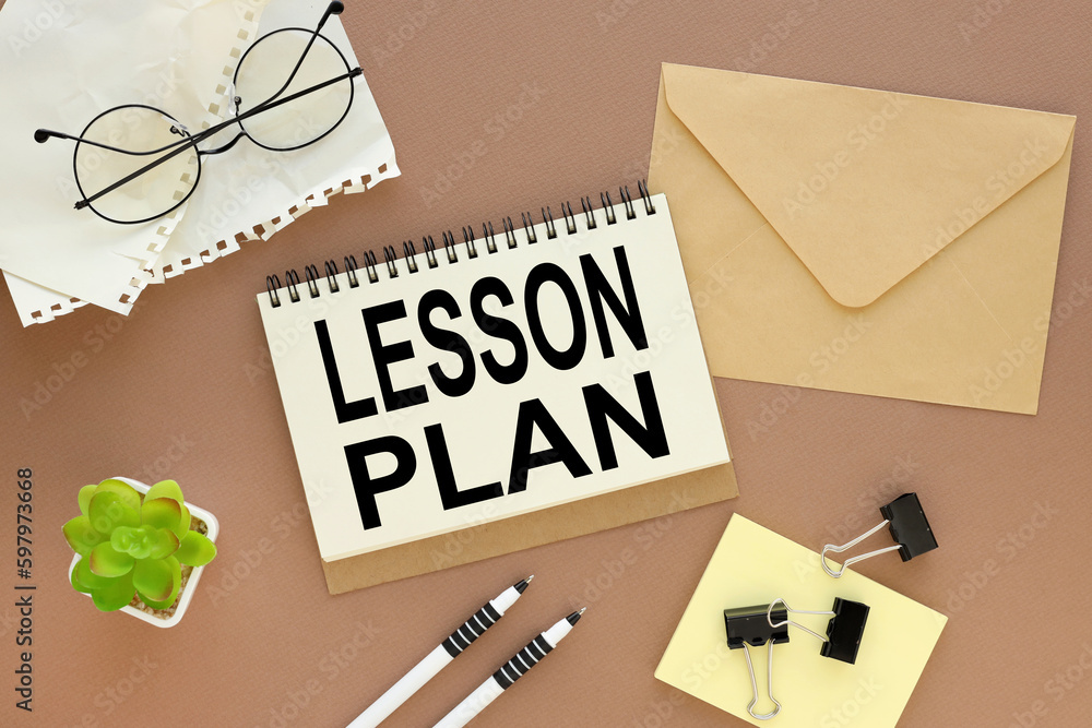 Poster lesson planning open notepad with text, coffee cup, pen, keyboard on brown background spiral notepad