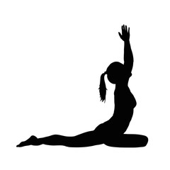 Fototapeta premium silhouette of a woman doing yoga