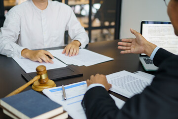 Lawyer Legal counsel presents to the client a signed contract with gavel and legal law. justice and...