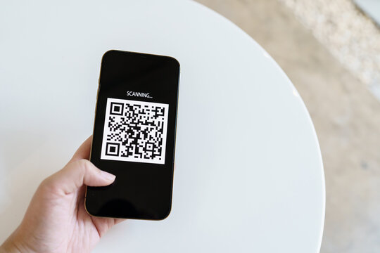 Qr code payment. E wallet. Man scanning tag accepted generate digital pay without money.scanning QR code online shopping cashless payment and verification technology concept.