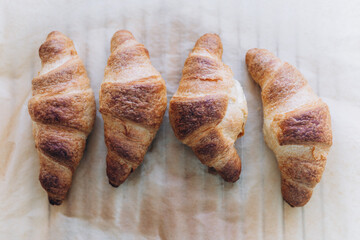 Freshly baked croissants with small flowers 