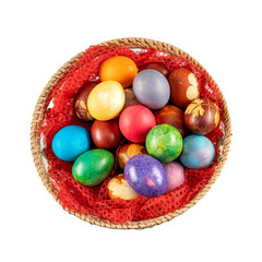 Fototapeta premium Top view of multicolored Easter eggs in a basket at white background. Pastel colored Easter eggs.