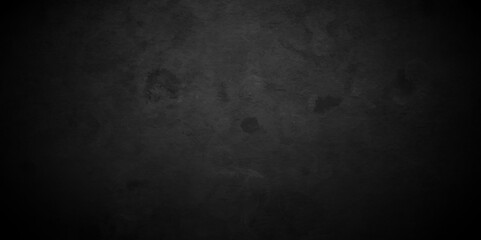 Fototapeta premium Dark black Close up retro plain dark black cement and concrete wall background texture. Background image of texture plaster on the wall in dark black tones in grunge style backdrop.