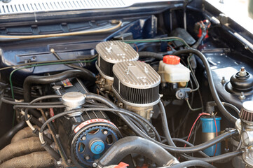 Fototapeta na wymiar Detail of the engine of a european muscle car