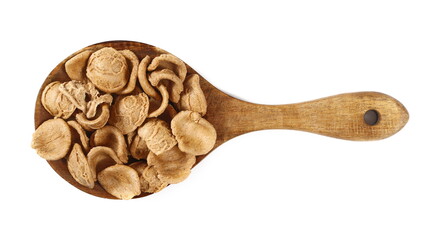 Orecchiette pasta uncooked in wooden spoon isolated on white, top view