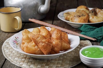 Youtiao or baby cakoi fried breadstick with pandan green sauce