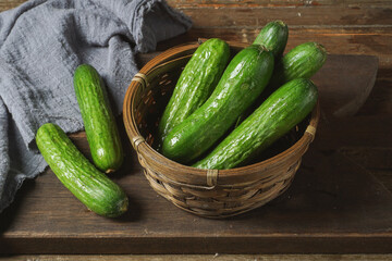 Crunchy mini cucumbers in a basket