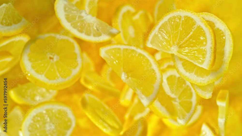 Aufkleber super slow motion of flying lemon slices on black background. filmed on high speed cinema camera, 10