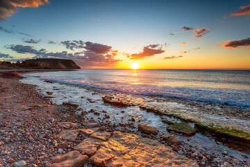 Beautiful sunrise over the Mediterranean sea at Playa las Palmeras
