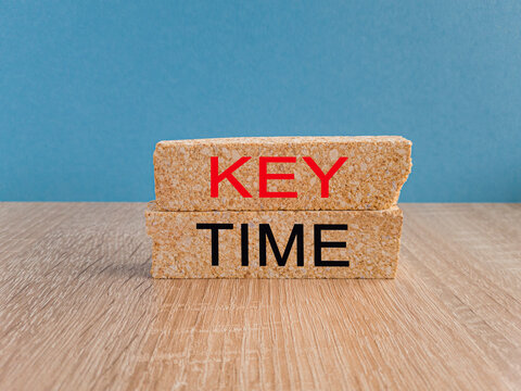 Time to key points symbol. Concept words Key points on brick blocks on a beautiful light blue background. Wooden table. Business and time to key points concept.