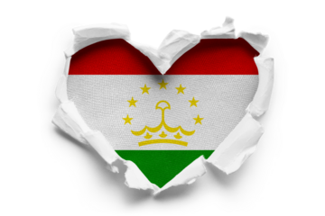 Heart shaped hole torn through paper, showing satin texture of flag of Tajikistan, cut out