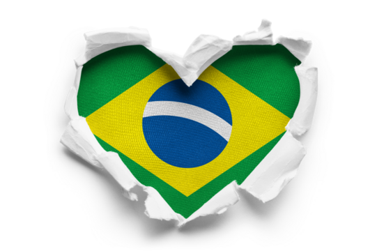 Heart shaped hole torn through paper, showing satin texture of flag of Brasil, cut out