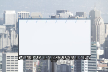 Obraz premium Blank white horizontal billboard on skyline background at daytime, front view. Mock up, advertising concept