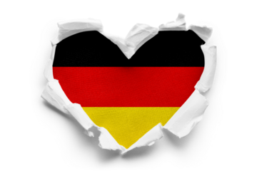 Heart shaped hole torn through paper, showing satin texture of flag of Germany, cut out