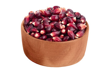 Purple corn seeds in wooden bowl isolated on white background with full depth of field