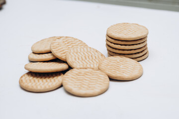 Cracker cookies lie on the table in a stack