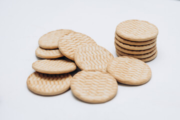 Cracker cookies lie on the table in a stack