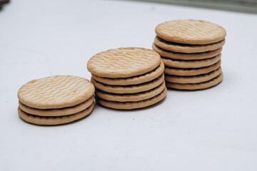 Cracker cookies lie on the table in a stack