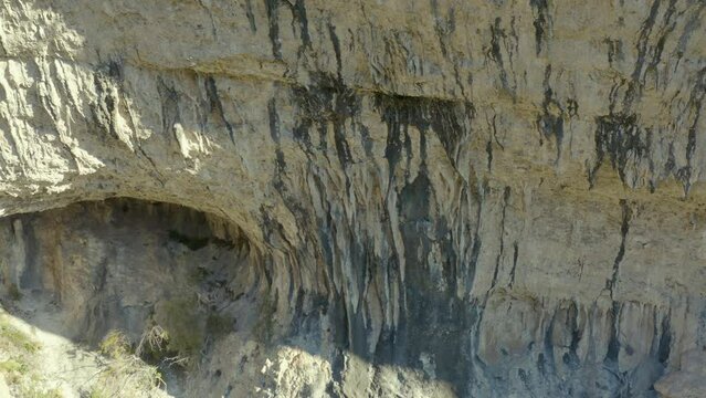 Aerial shot of a limestone cliff to climb in an arid landscape, Saint-L&eacute;ger du Ventoux, France