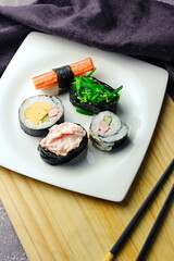 close up of sashimi sushi set with chopsticks and soy