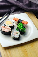 close up of sashimi sushi set with chopsticks and soy