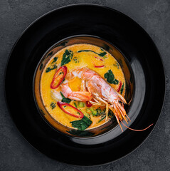Tom yam is a spicy soup with shrimp. Restaurant soup food.