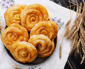 Tasty raising buns on a cloth background