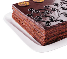 cake on white plate with topping chocolate
