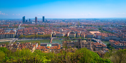 Lyon city skyline, red rooftop houses, the Saone River, and geometric topography of the World Heritage Site, a view from Esplanade du Site Notre-Dame de Fourvière in France