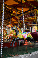 Obraz na płótnie Canvas Daytime British colorful carnival fair amusement park rides