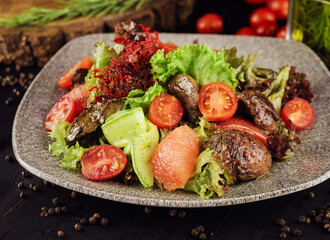 Meat and vegetable salad on plate