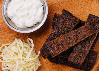 Black garlic bread snack with suluguni cheese
